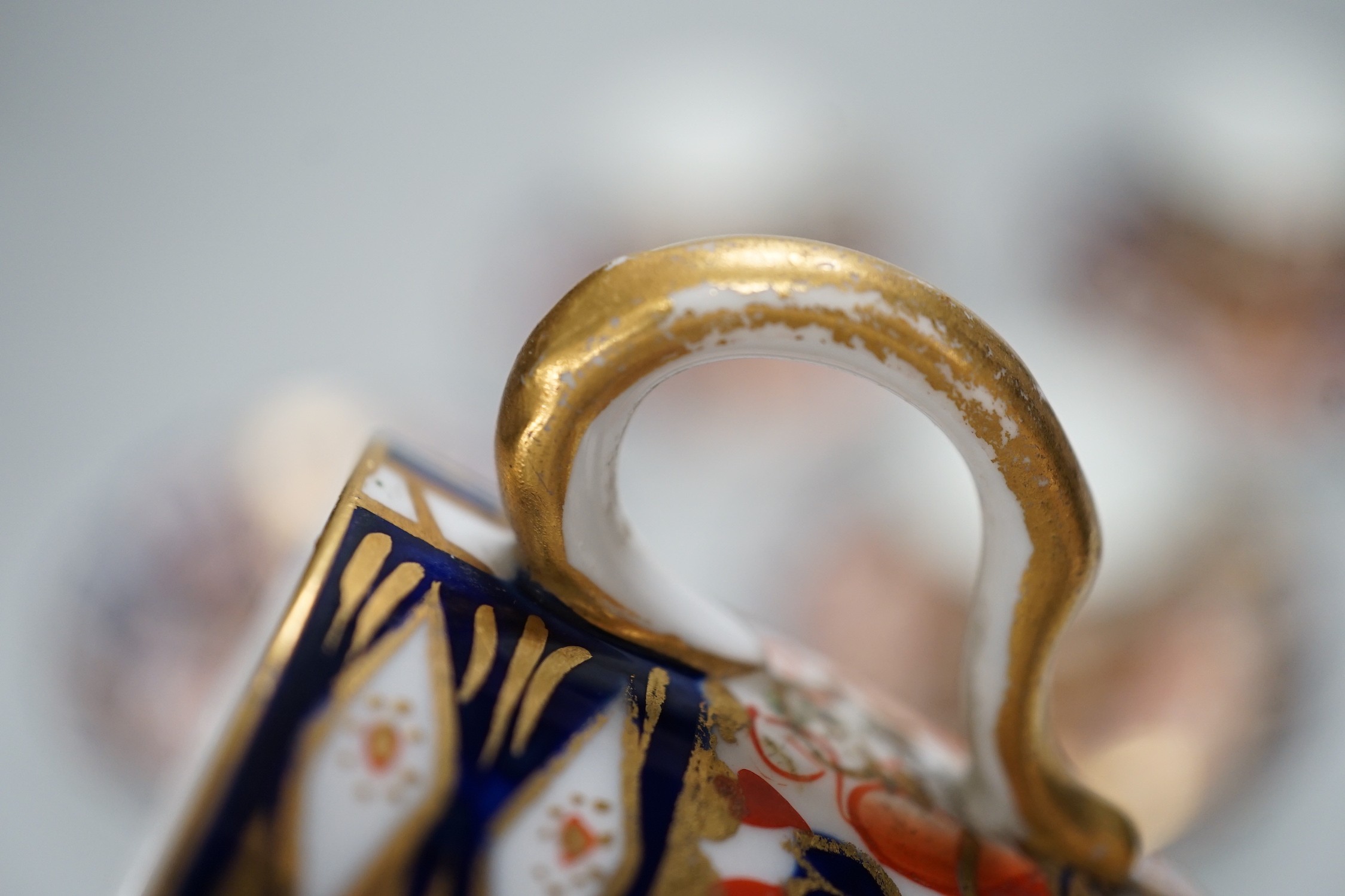Five Royal Crown Derby Imari coffee cans and saucers